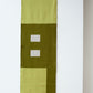 Een productfoto van de mos groene tafelrunner van Kathryn Clark