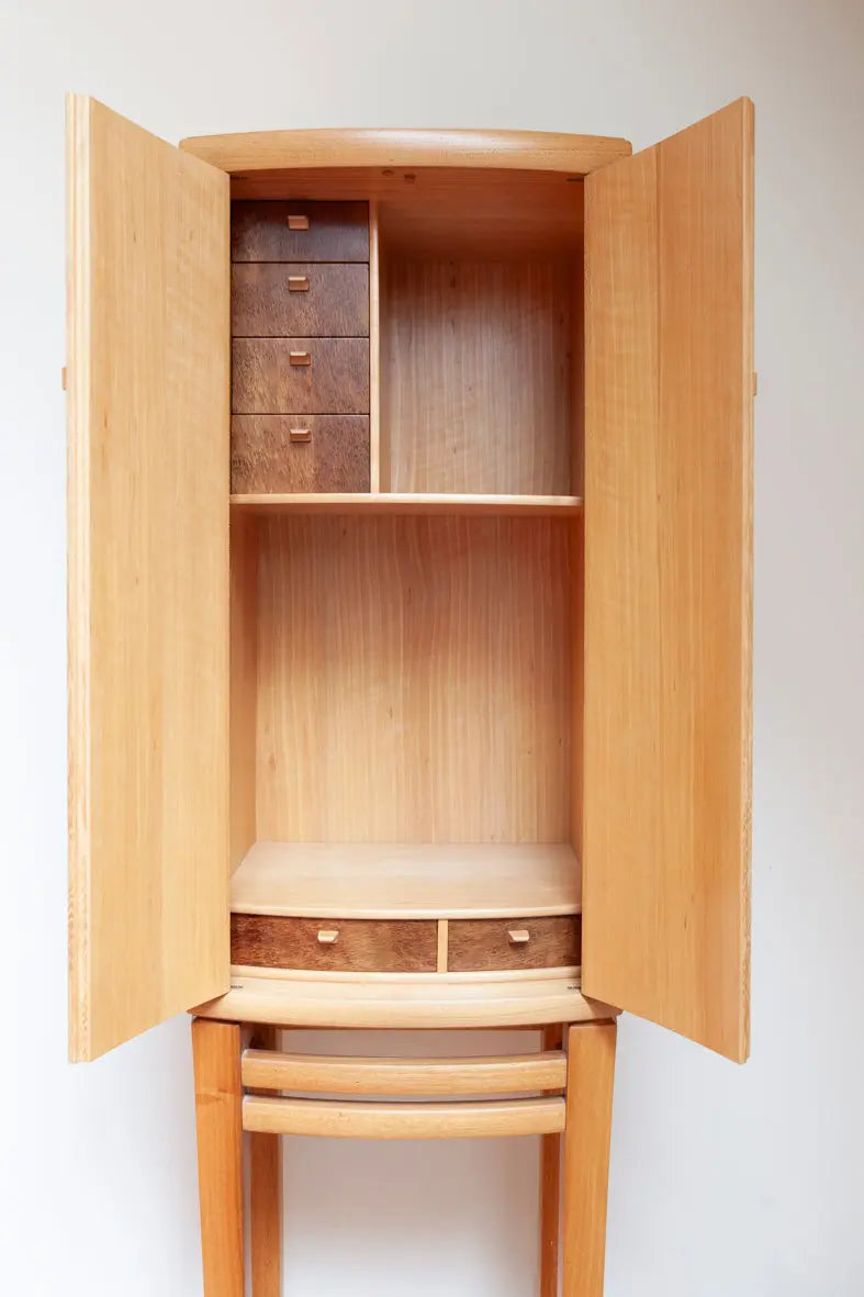 The handmade Tea Cabinet No. 1 is a graceful addition to any room. Fingerprint Furniture